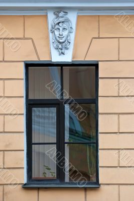 A window with a bas-relief.