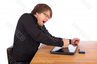 Angry man knock with his fist on his laptop