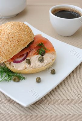 Salmon sandwich and a cup of coffee