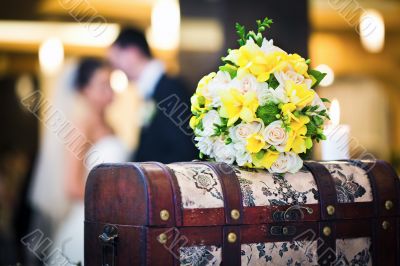 Wedding bouquet with bride and groom