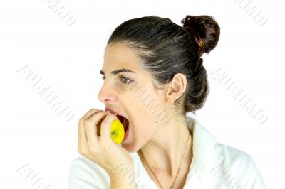 Girl taking a bite of an apple.
