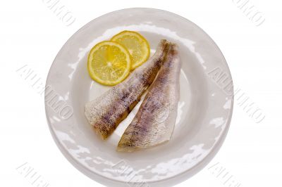 Raw fish fillets with lemon