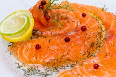 Salmon carpaccio with pink pepper
