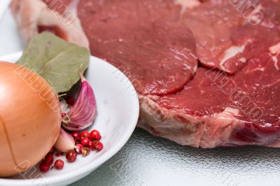 Beef steak with bowl of spices