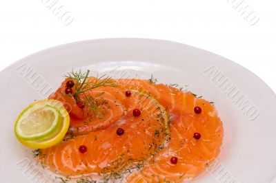 Salmon carpaccio with pink pepper