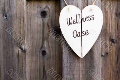 Wooden fence and wellness signboard