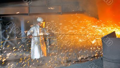 mill worker with hot steel