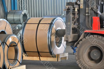 Forklift with rolls of steel sheet