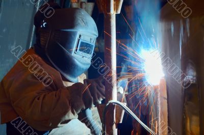a welder working at shipyard