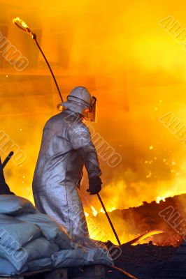 worker with hot steel worker with hot steel