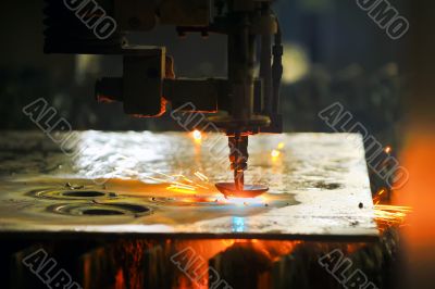 Laser cutting metal sheet