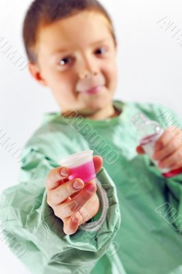 little doctor boy giving syrup