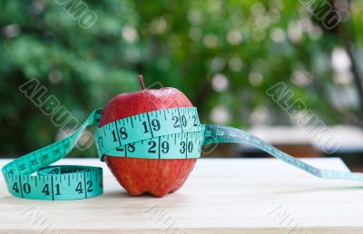 Apple and measuring tape 