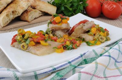 Fillet of fish under vegetables