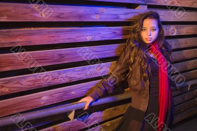Mixed Race Young Adult Woman Against a Wood Wall Background Mixed Race Young Adult Woman Against a Wood Wall Background
