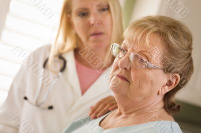 Senior Adult Woman Being Consoled by Female Doctor or Nurse