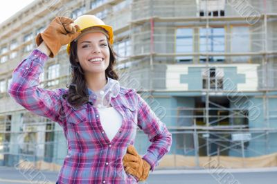 Young Attractive Female Construction Worker Wearing Hard Hat and