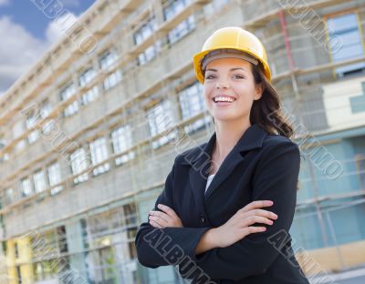 Portrait of Female Contractor Wearing Hard Hat at Construction S