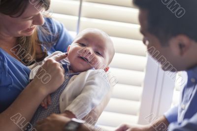 Mixed Race Couple Enjoying Their Newborn Son