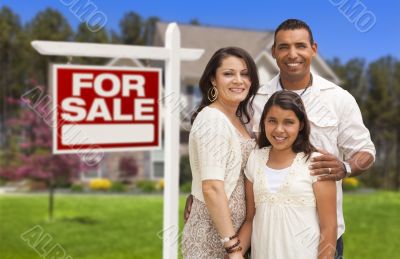 Hispanic Family in Front of Their New Home and Sign