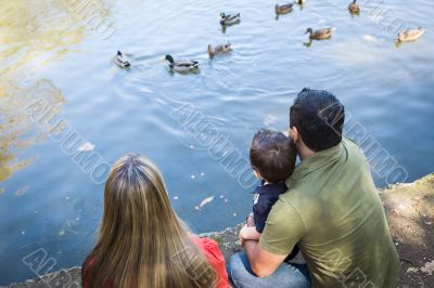 Mixed Race Mother and Father with Son at the Pond