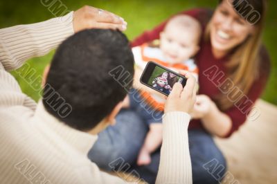 Happy Mixed Race Parents and Baby Boy Taking Self Portraits