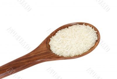 wooden spoon and rice isolated on white background 