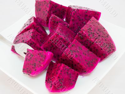 dragon fruits and  slice on plate 