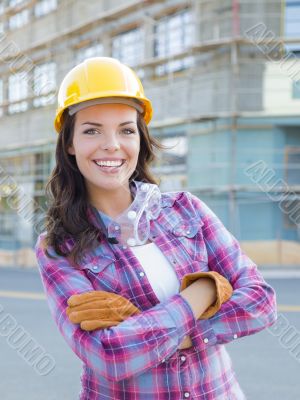 Young Attractive Female Construction Worker Wearing Hard Hat and