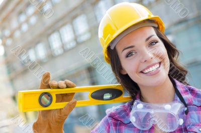 Young Attractive Female Construction Worker Wearing Hard Hat and