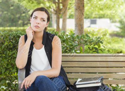 Melancholy Young Adult Woman Sitting on Bench Next to Books Melancholy Young Adult Woman Sitting on Bench Next to Books
