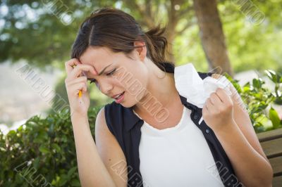 Upset Young Woman with Pencil and Crumpled Paper in Hand Upset Young Woman with Pencil and Crumpled Paper in Hand