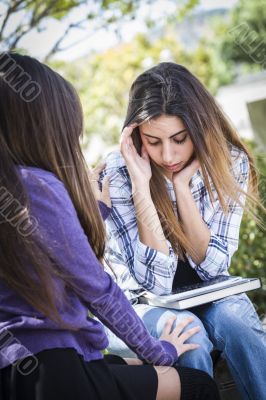 Stressed Sad Young Mixed Race Girl Being Comforted By Friend