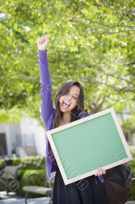 Excited Mixed Race Female Student Holding Blank Chalkboard