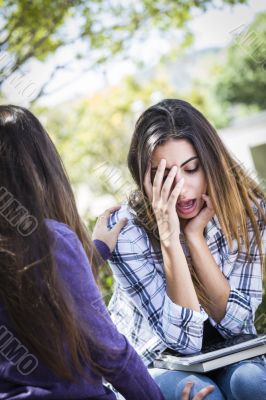 Stressed Sad Young Mixed Race Girl Being Comforted By Friend