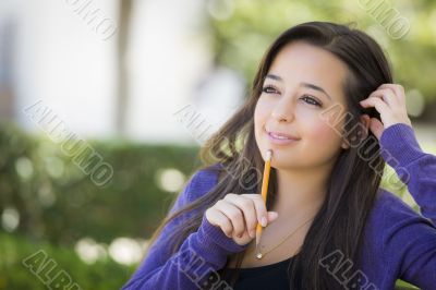 Pensive Mixed Race Female Student with Pencil on Campus