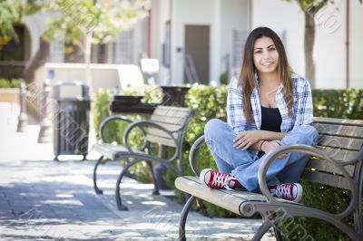 Mixed Race Female Student Portrait on School Campus Bench