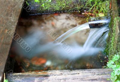 Water was flowing from an underground source, the spring.