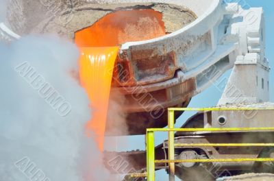 The molten slag is poured from a cup 