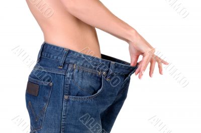 slim girl in big jeans