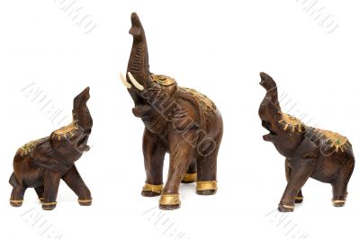 Three wooden statues of elephants