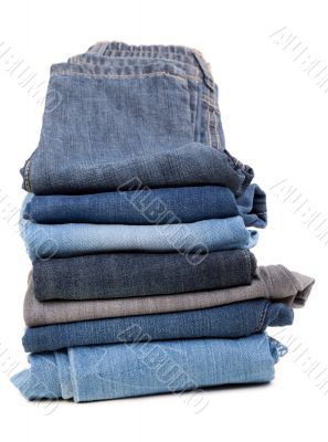 Stack of jeans isolated on white background