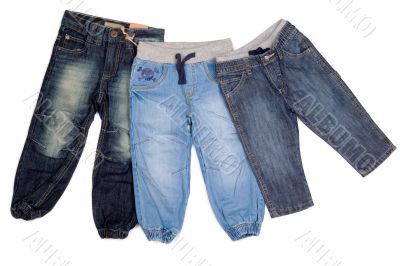 three different children`s jeans