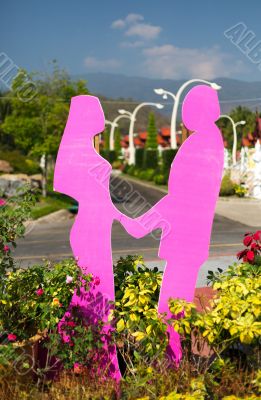 figurines of lovers in a botanical garden