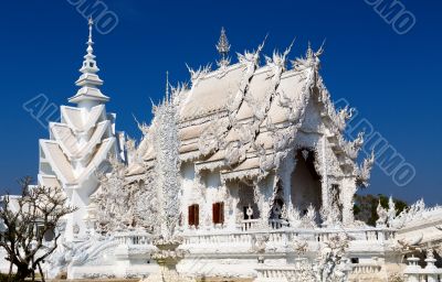 Main chapel of the famous Wat Rong Khun (White temple) in Thaila