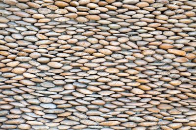 stone wall, lined with pebbles