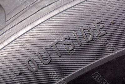 inscription on the wheel close-up `outside`