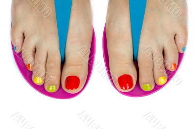 Beautiful female feet with a pedicure color