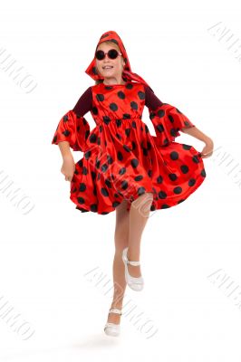 teen girl dancing in a red polka-dot dress with sunglasses