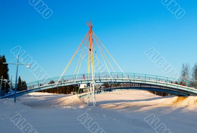 small bridge on the background of a winter landscape